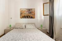 A bed or beds in a room at Casa Catania
