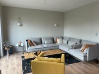 a living room with a couch and a table at Superbe appartement haut de gamme centre ville in Le Mans