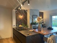 a kitchen with a counter and a sink in it at Superbe appartement haut de gamme centre ville in Le Mans