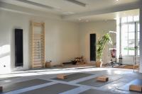 a living room with a large room with a table at DOMAINE LE MEZO in Ploeren