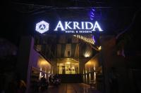 un cartel en el costado de un edificio por la noche en NT Hotels and Resorts Akridha, en Pondicherry