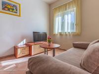 Televízia a/alebo spoločenská miestnosť v ubytovaní Apartment Rok 4 by Interhome
