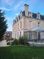 a large house with a lawn in front of it at LES 5 ESCALES in Parthenay