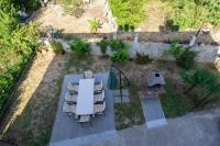 Vonkajšia záhrada v ubytovaní Apartmani Malbašić