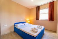 Posteľ alebo postele v izbe v ubytovaní Apartmani Malbašić