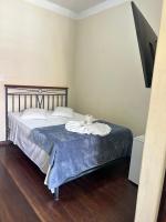 Hotel Chão Mineiroにあるベッド