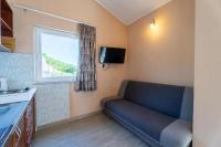 Televízia a/alebo spoločenská miestnosť v ubytovaní Apartmani Malbašić