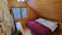 Postel nebo postele na pokoji v ubytování Penzion Srub Panorama