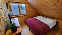 Postel nebo postele na pokoji v ubytování Penzion Srub Panorama
