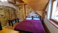 Postel nebo postele na pokoji v ubytování Penzion Srub Panorama