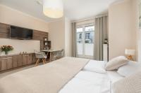 Łóżko lub łóżka w pokoju w obiekcie Apartamenty Aquamarina by Noclegi Renters