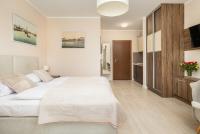 Łóżko lub łóżka w pokoju w obiekcie Apartamenty Aquamarina by Noclegi Renters
