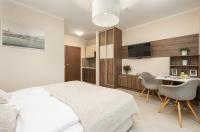 Łóżko lub łóżka w pokoju w obiekcie Apartamenty Aquamarina by Noclegi Renters