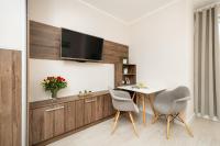 Telewizja i/lub zestaw kina domowego w obiekcie Apartamenty Aquamarina by Noclegi Renters