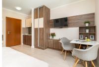 Telewizja i/lub zestaw kina domowego w obiekcie Apartamenty Aquamarina by Noclegi Renters