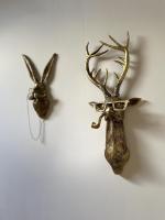 two antlers of a deer hanging on a wall at Le Taurillou 