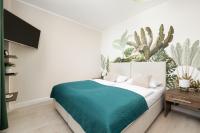 Łóżko lub łóżka w pokoju w obiekcie Apartamenty Aquamarina by Noclegi Renters