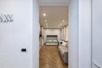 A bed or beds in a room at MagnoliaApartments - 5 Nirone Center