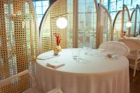 a table in a restaurant with a white table cloth at AR Diamante Beach & SPA Hotel 4 SUP in Calpe