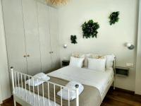 Posteľ alebo postele v izbe v ubytovaní Sky Apartment