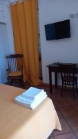 Televízia a/alebo spoločenská miestnosť v ubytovaní La Casa Del Sole