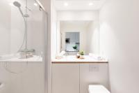 a bathroom with a shower and a toilet and a sink at Les Appartements de Grenoble in Grenoble