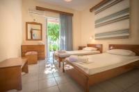 A bed or beds in a room at Natasa Studios