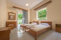 A bed or beds in a room at Natasa Studios