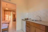 A kitchen or kitchenette at Natasa Studios