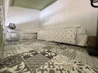 a room with a bed and a patterned floor at Poussan, Villa des Oliviers, superbe villa classé in Poussan