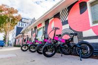 a row of motorcycles parked next to a building at Santa Monica Hotel in Los Angeles