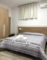 A bed or beds in a room at Villa Magiola Pompei
