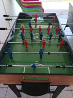 a group of men playing a game of pool at Villa Imelda à saint André la réunion in Le Patelin