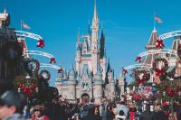 a crowd of people standing in front of a castle at Le Nuage d&#39;Arianne*Vale d&#39;Europe *Disney*Paris in Chessy