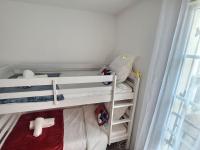 a small room with two bunk beds and a window at Le Nuage d&#39;Arianne*Vale d&#39;Europe *Disney*Paris in Chessy