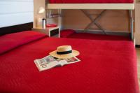 Łóżko lub łóżka w pokoju w obiekcie Ciccio Hotel