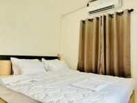 Postel nebo postele na pokoji v ubytování La Villas@Suanphueng