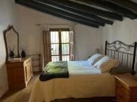 A bed or beds in a room at Cortijo Vacas Gordas Villas