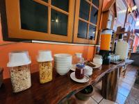 eine Theke mit einigen Lebensmitteln darauf in der Unterkunft Khao Sok Las Orquideas Resort in Khao Sok