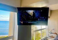 Suite Coco CarIbe con Doccia Vista Mareにあるテレビまたはエンターテインメントセンター