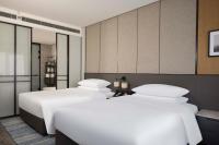 Sheraton Pujiangにあるベッド