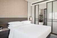 Sheraton Pujiangにあるベッド