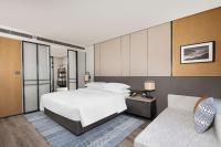 Sheraton Pujiangにあるベッド
