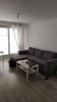 a living room with a couch and a coffee table at T2 de 42m² A proximité de la gare à 30min de PARIS in Mantes-la-Jolie