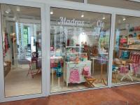 a store front of a store with a window at Le Cosy - Studio spacieux, équipé, proche Plage &amp; Piscine, au Manganao in Saint-François