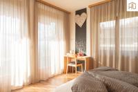 Łóżko lub łóżka w pokoju w obiekcie Haus Percha Mountain Apartments