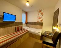Łóżko lub łóżka w pokoju w obiekcie Hotel Alta Vista
