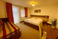 Łóżko lub łóżka w pokoju w obiekcie Hotel Alta Vista
