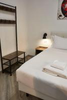 A bed or beds in a room at The Roman Way San Giovanni
