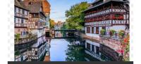 a view of a river between two buildings at MOBIL HOME Clim BOOFZHEIM 6 PERSONNES 3 CHAMBRES LE RIED 3 ETOILES PROCHE EUROPA PARK in Boofzheim